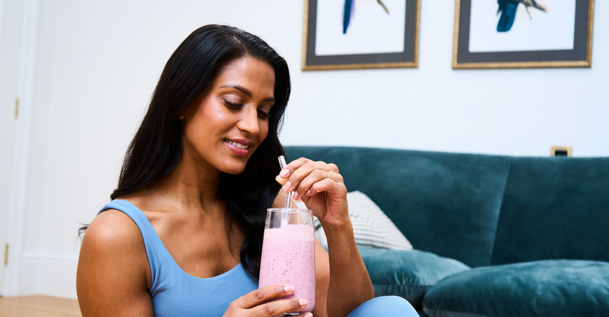 woman drinking a protein shake