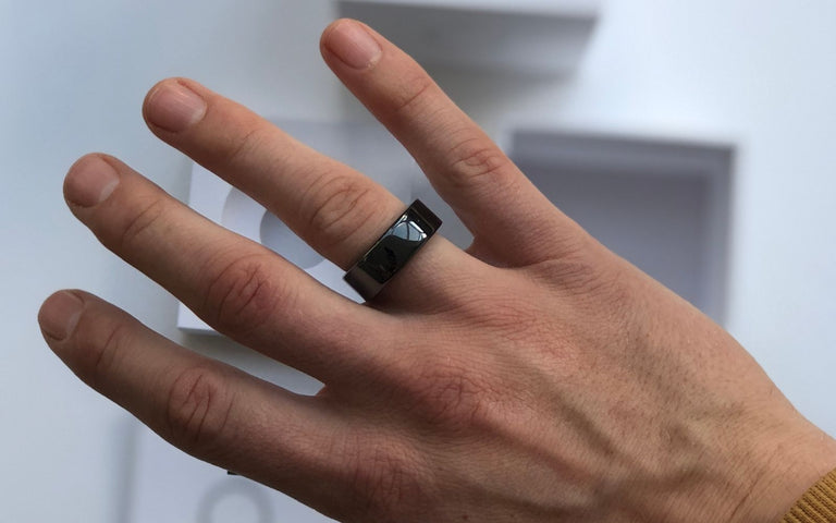 Oura ring on mans hand 