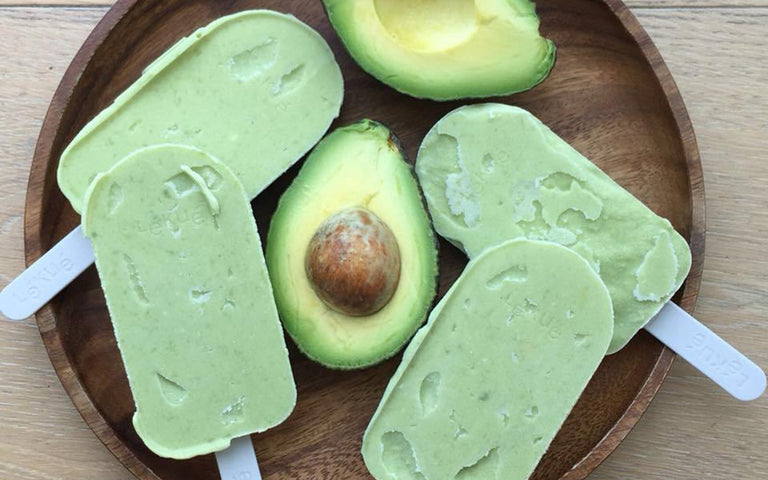 Icecream Lollies with avocado on wooden plate