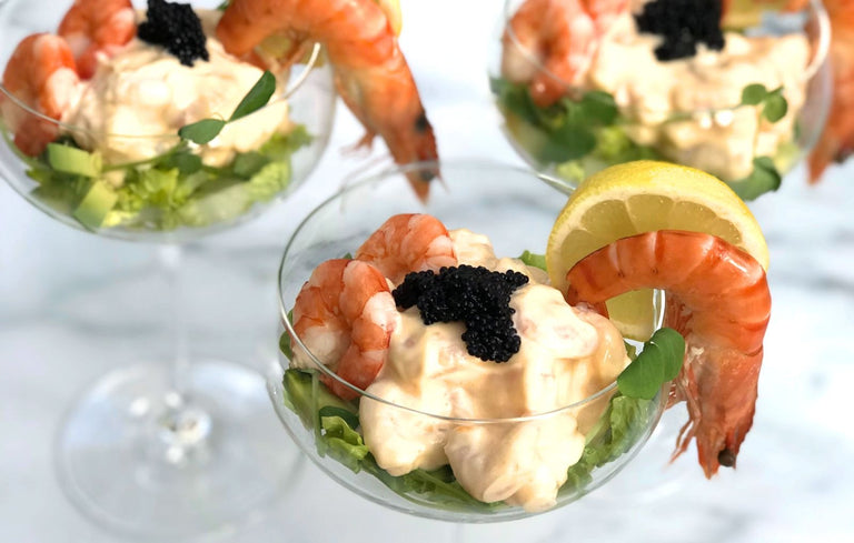glass bowls with prawns and lemon