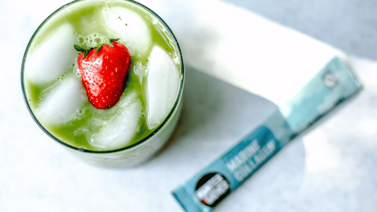 strawberry iced matcha in a glass with marine collagen peptides