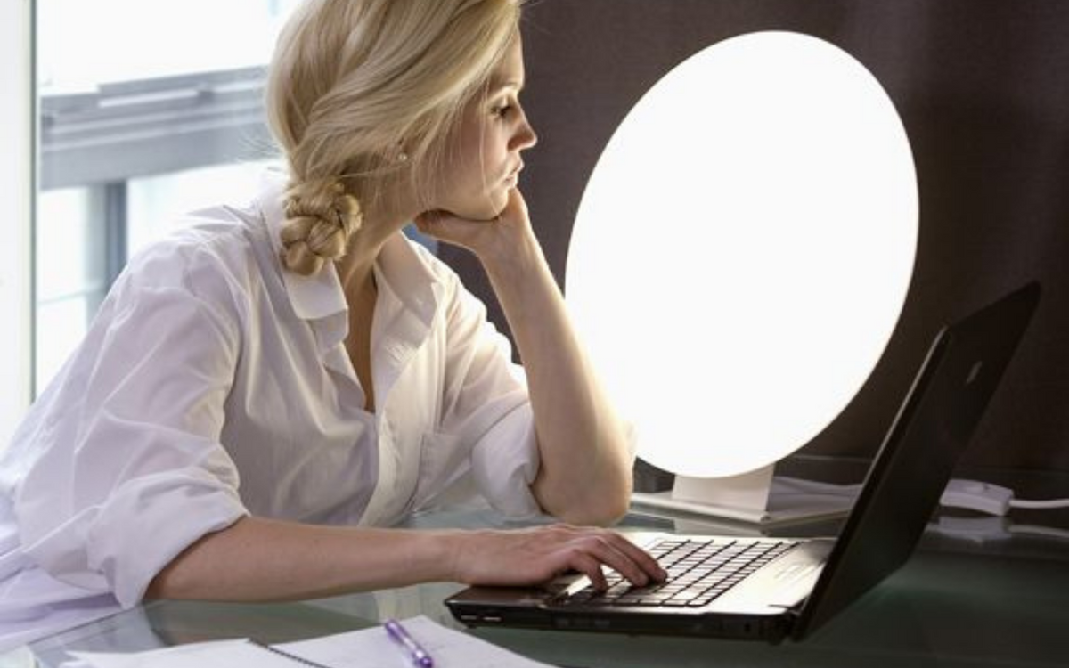Lady with Sad Lamp for Seasonal Affective Disorder