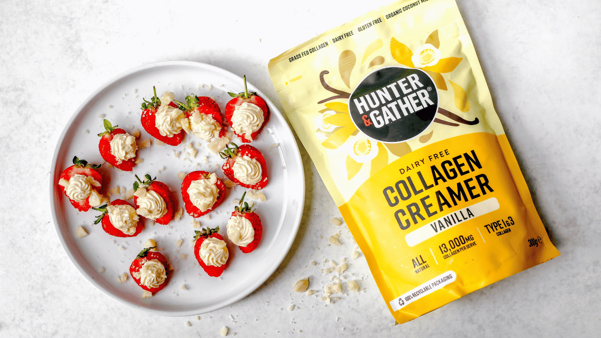 cheesecake stuffed strawberries on a plate with vanilla collagen creamer by hunter and gather