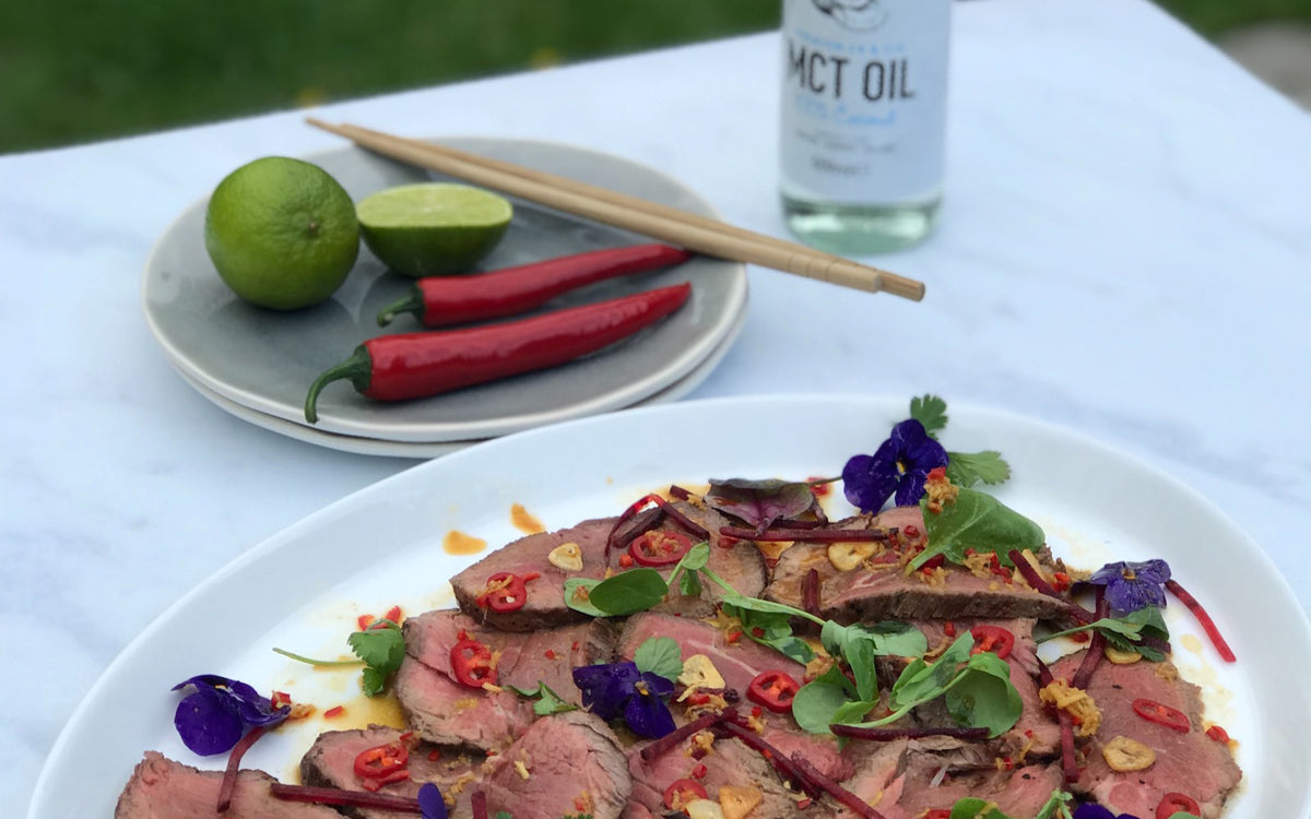slices of steak with medium chain triglyceride drizzle
