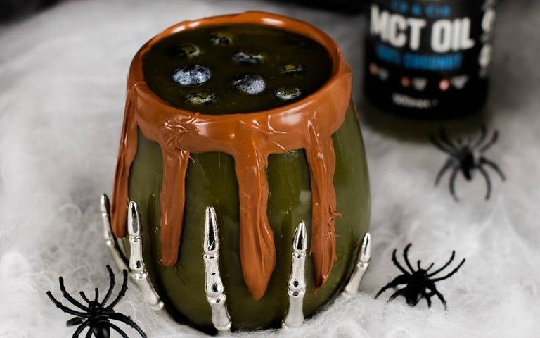 green chocolate drink in a glass bowl with collagen peptide protein powder