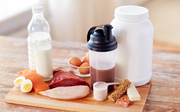 Cutting diet: Protein shake next to lean meats, milk and eggs