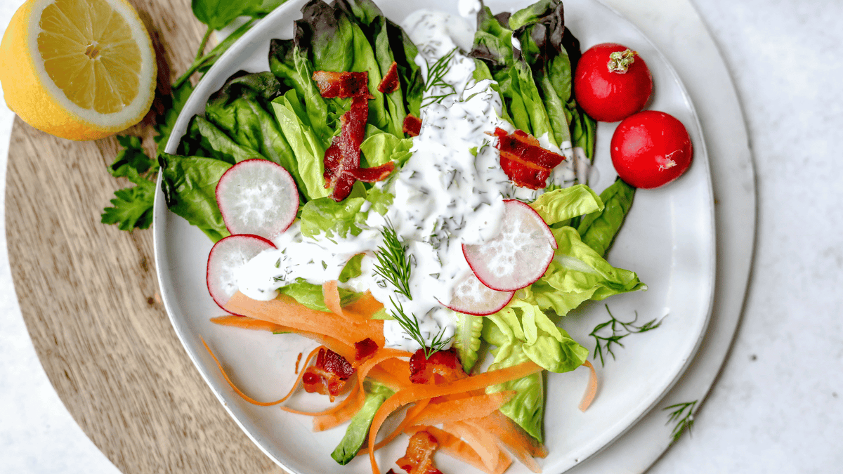 ranch dressing on salad with lemon
