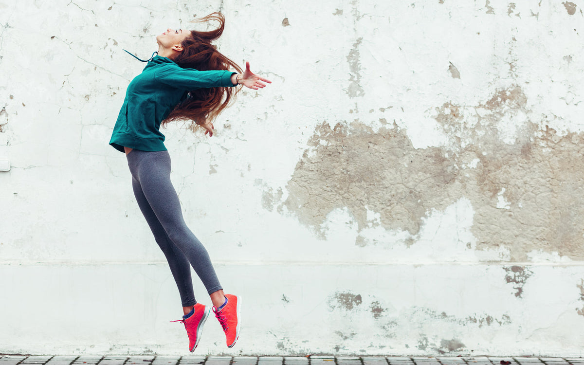 Lady jumping into the air 