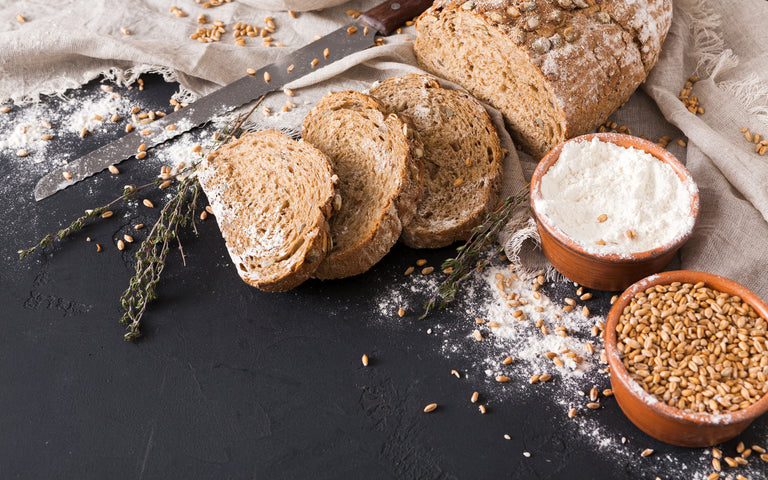 bread and grains on a black background