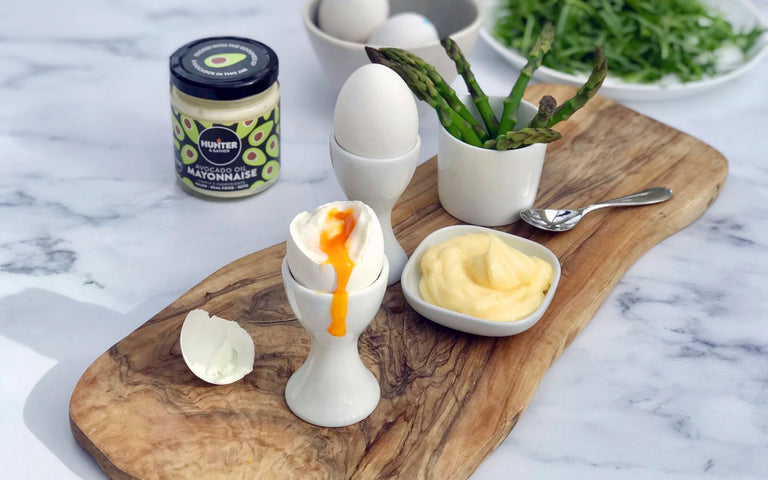 wooden board with dippy eggs and soldiers