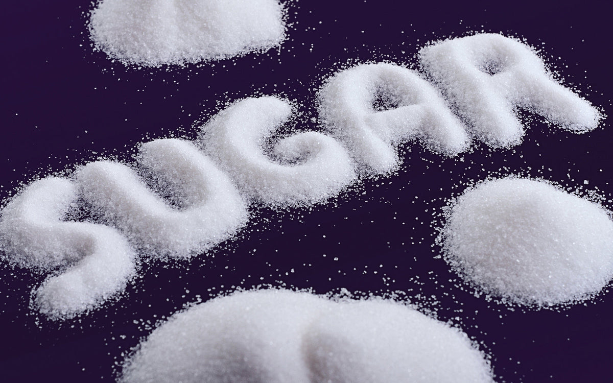 white sugar on black background