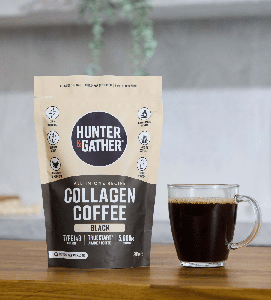 Hunter & Gather collagen coffee package with a glass of coffee on a wooden surface.