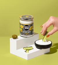 Dipping Cucumber Into Classic Egg Free Olive Oil Mayo