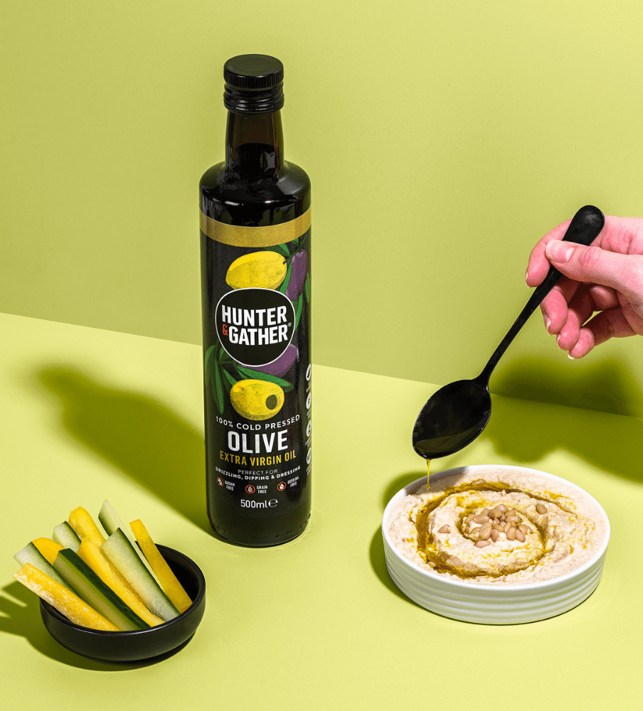 Organic Cold Pressed Extra Virgin Olive Oil Drizzled Into Pesto
